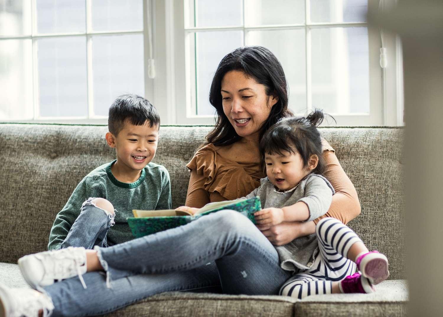 Mother teaching her children how to read