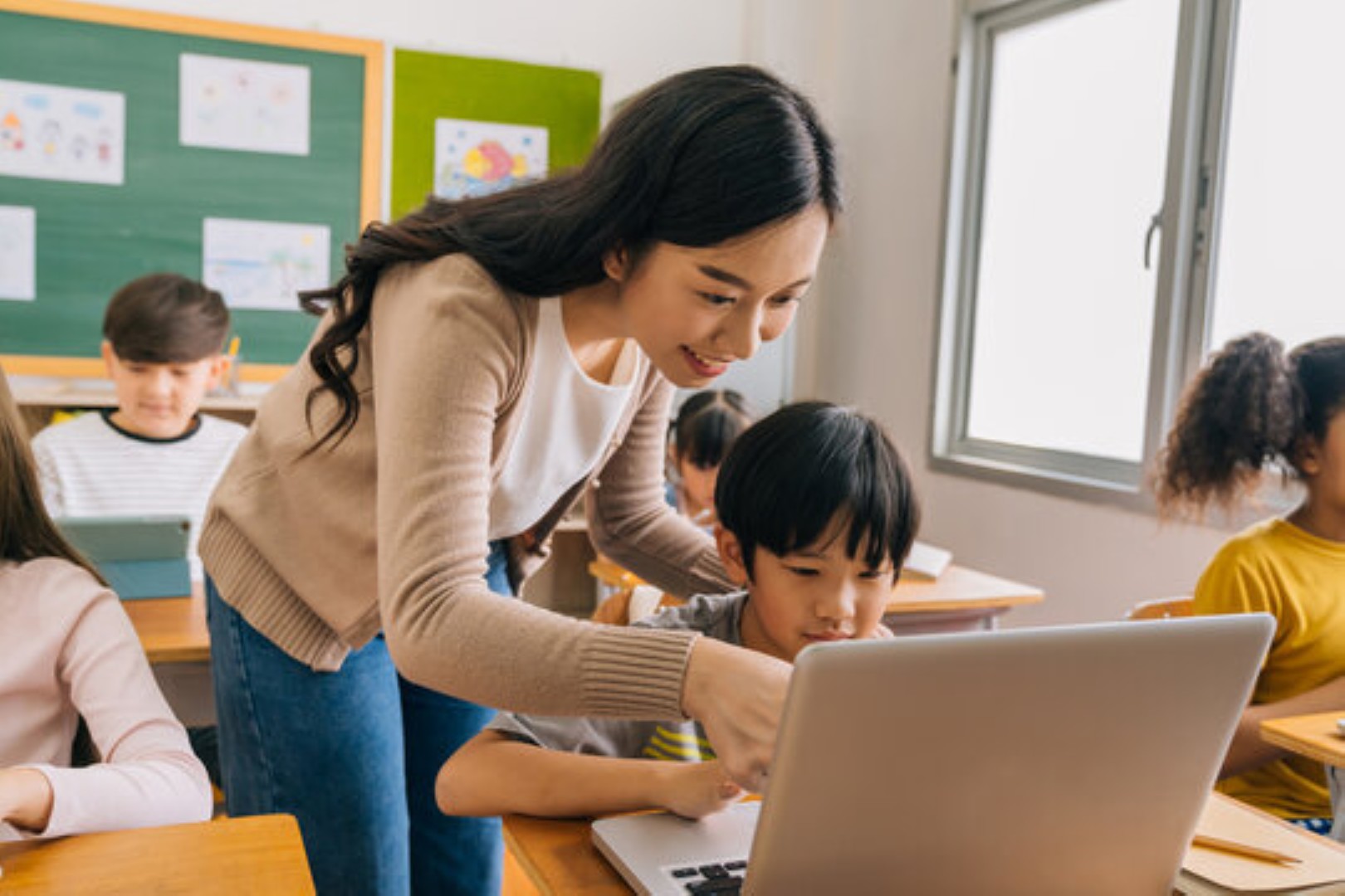 Mom and her child studying on a laptop